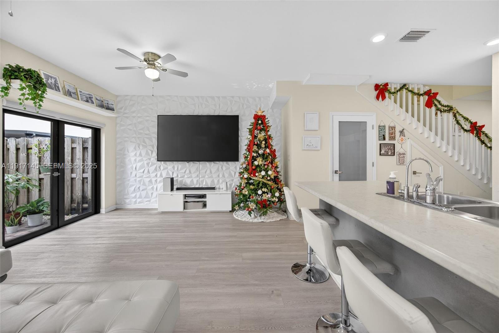 11527 Southwest 248th Lane Homestead, FL 33032 - Photo 13 of 44 a living room with furniture and a flat screen tv
