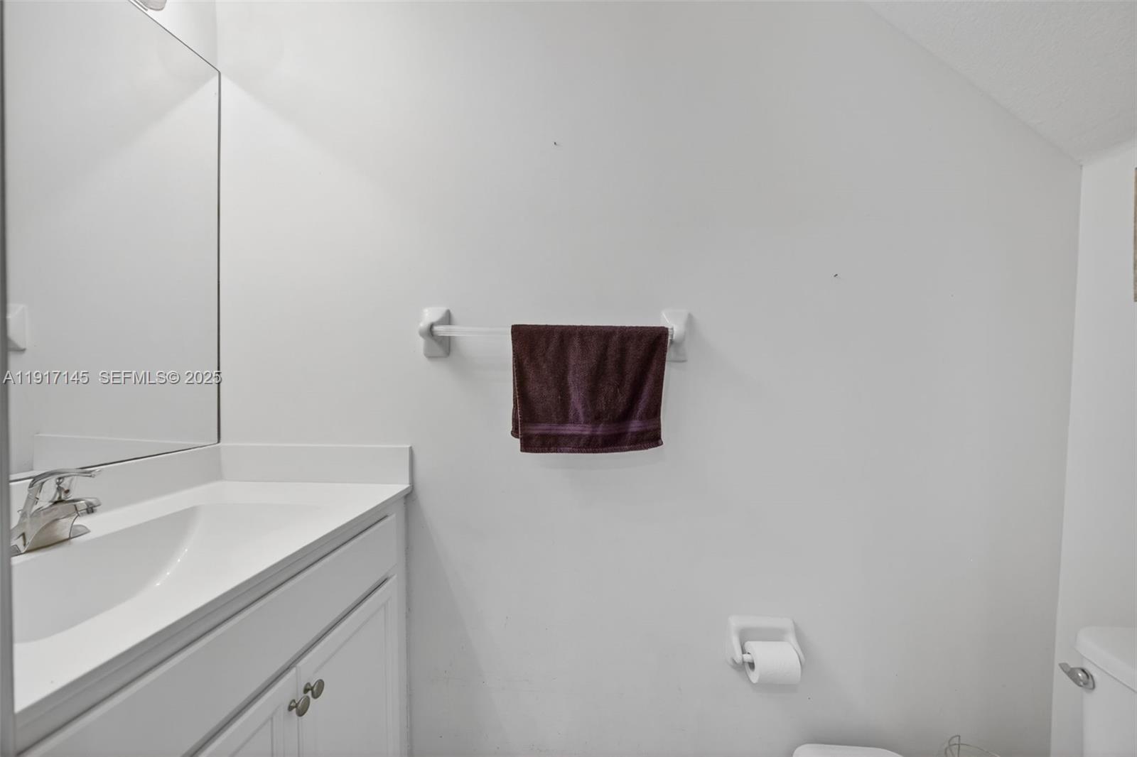 11527 Southwest 248th Lane Homestead, FL 33032 - Photo 14 of 44 a bathroom with a sink and a mirror