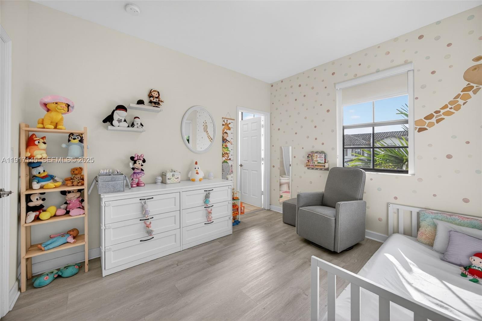 11527 Southwest 248th Lane Homestead, FL 33032 - Photo 23 of 44 a bedroom with furniture and a wooden floor