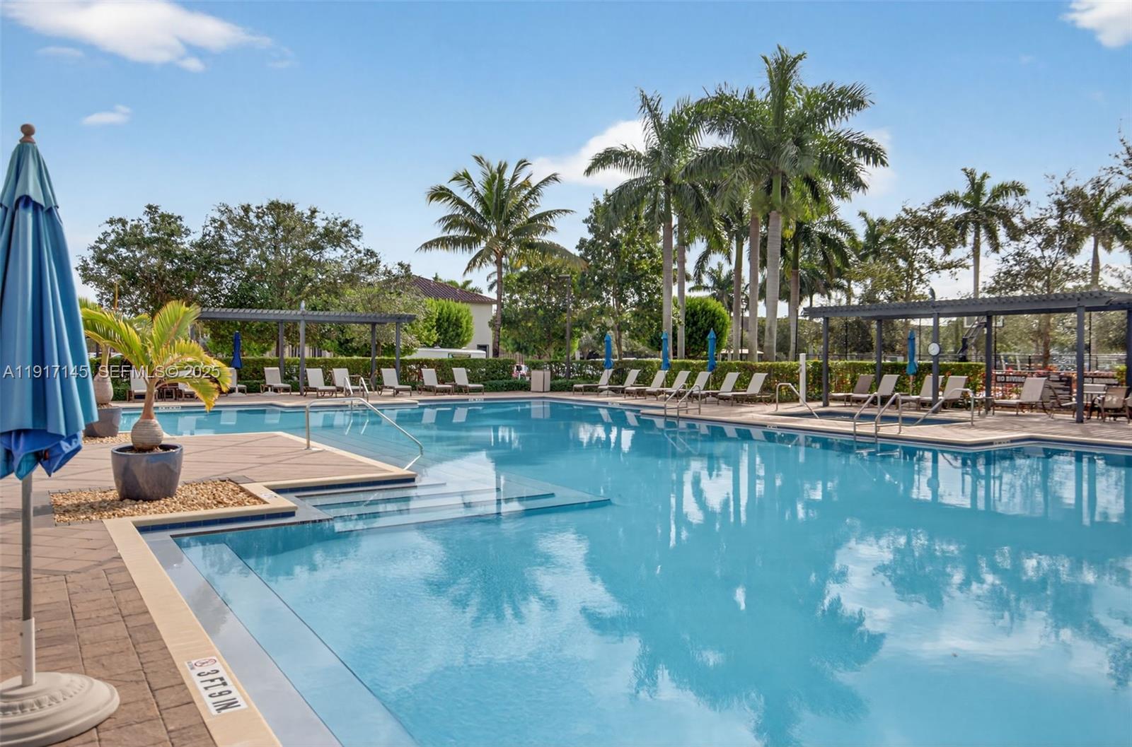 11527 Southwest 248th Lane Homestead, FL 33032 - Photo 36 of 44 a view of a swimming pool with chairs
