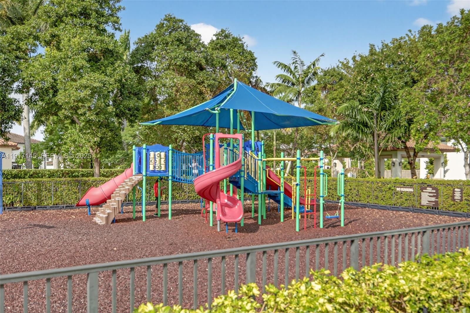 11527 Southwest 248th Lane Homestead, FL 33032 - Photo 41 of 44 a view of park with slide and a bench