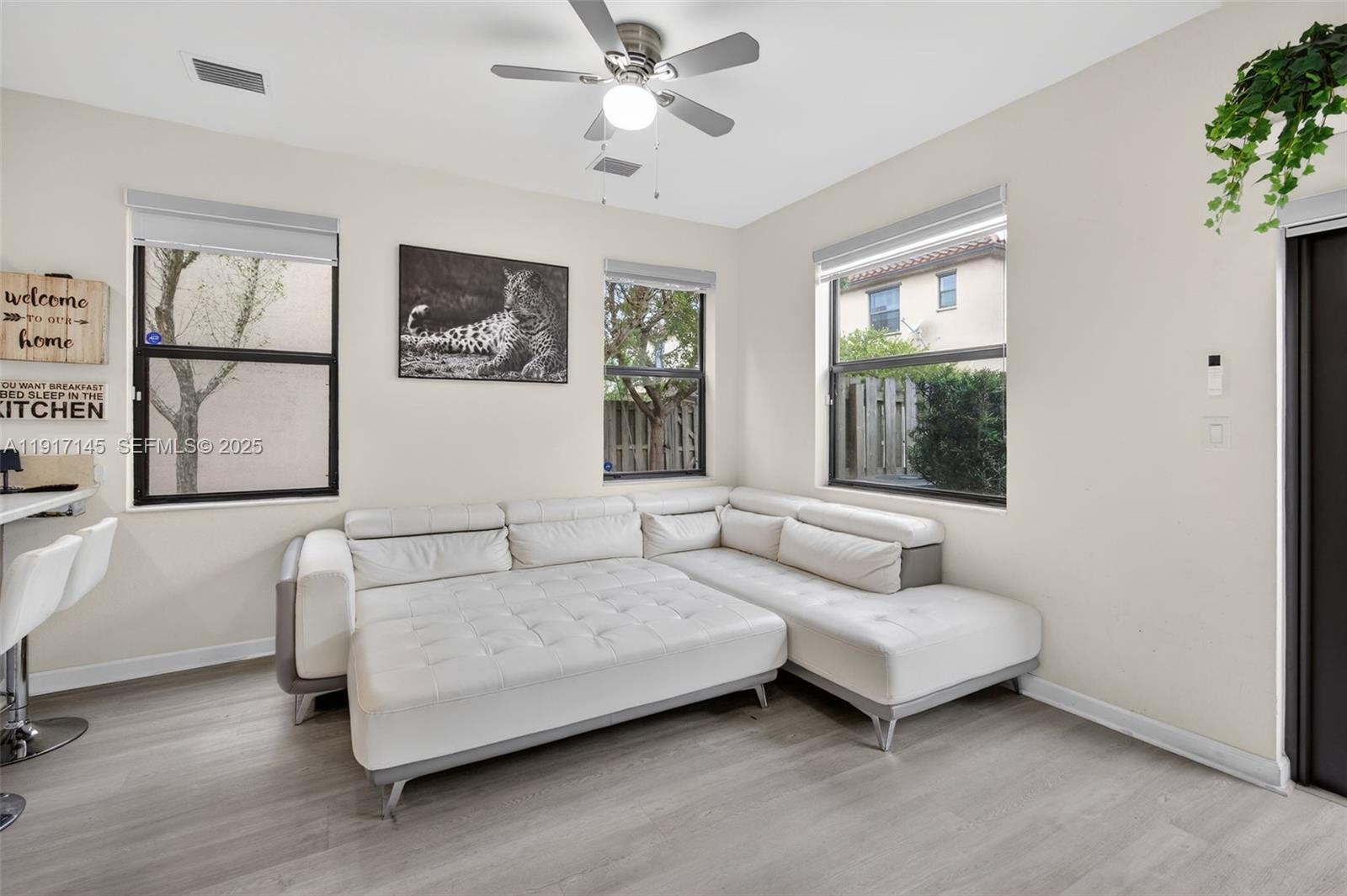11527 Southwest 248th Lane Homestead, FL 33032 - Photo 10 of 44 a living room with furniture and a window
