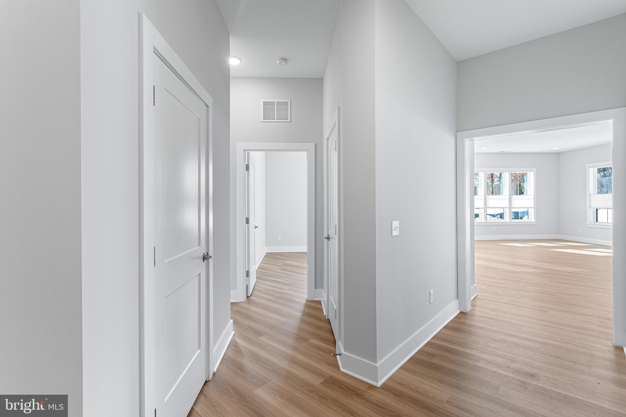 76 Old Mill Bottom Road North, Unit 102 Annapolis, MD 21409 - Photo 15 of 42 a view of a hallway with wooden floor