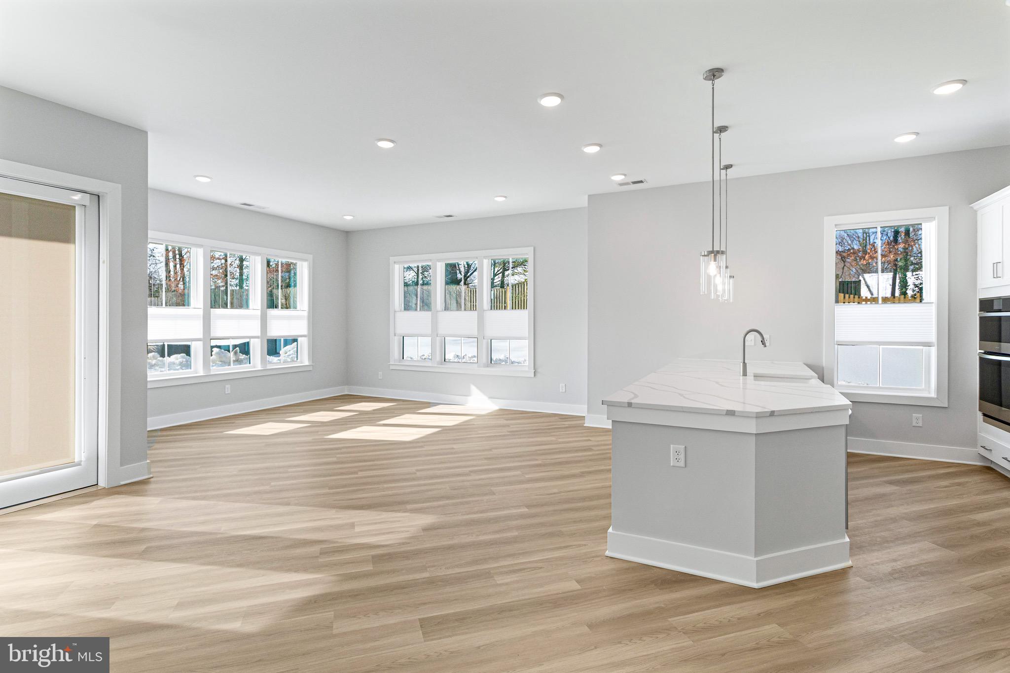 76 Old Mill Bottom Road North, Unit 102 Annapolis, MD 21409 - Photo 16 of 42 a view of an empty room with wooden floor and a window