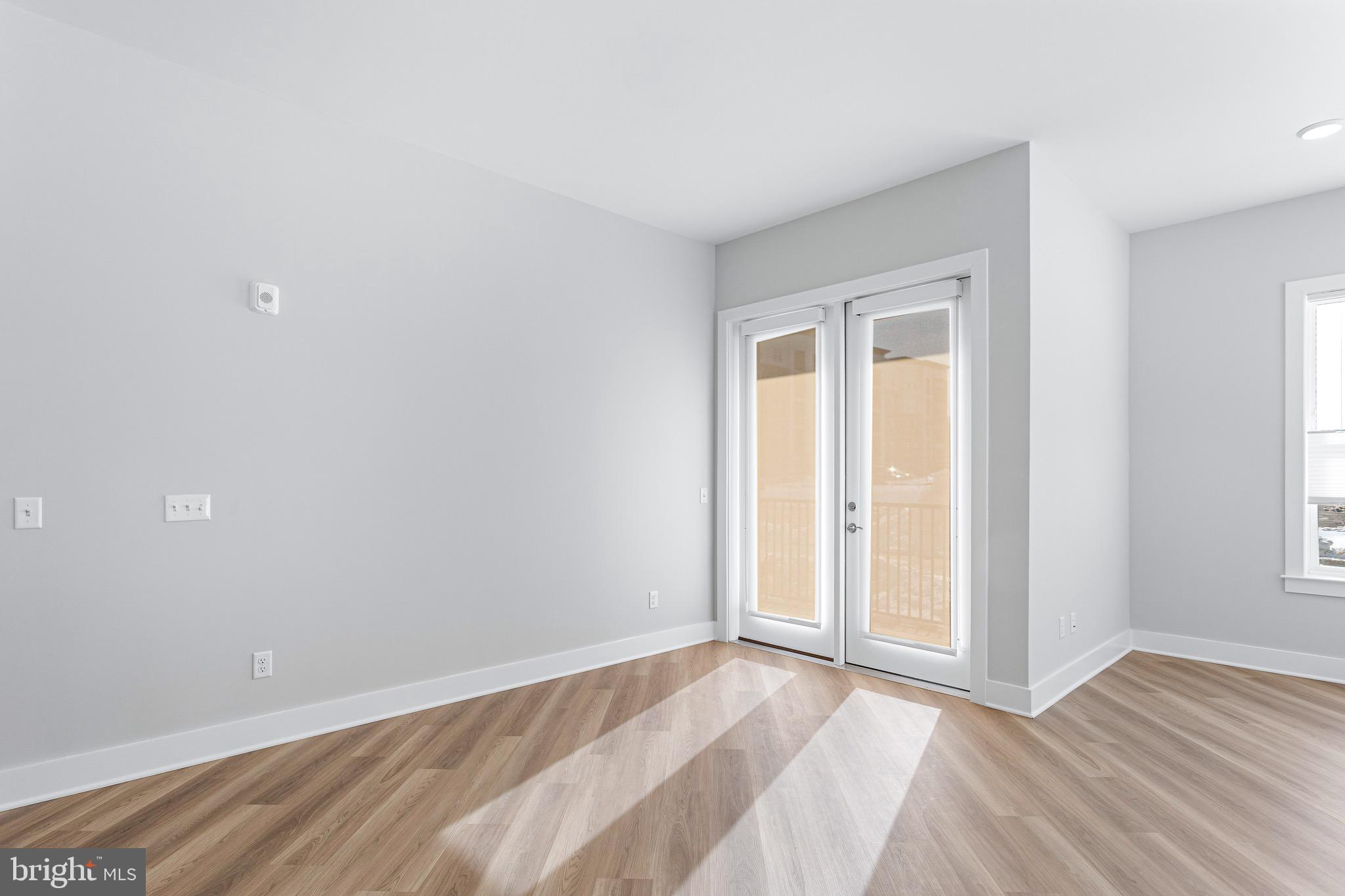 76 Old Mill Bottom Road North, Unit 102 Annapolis, MD 21409 - Photo 19 of 42 wooden floor and window in a room
