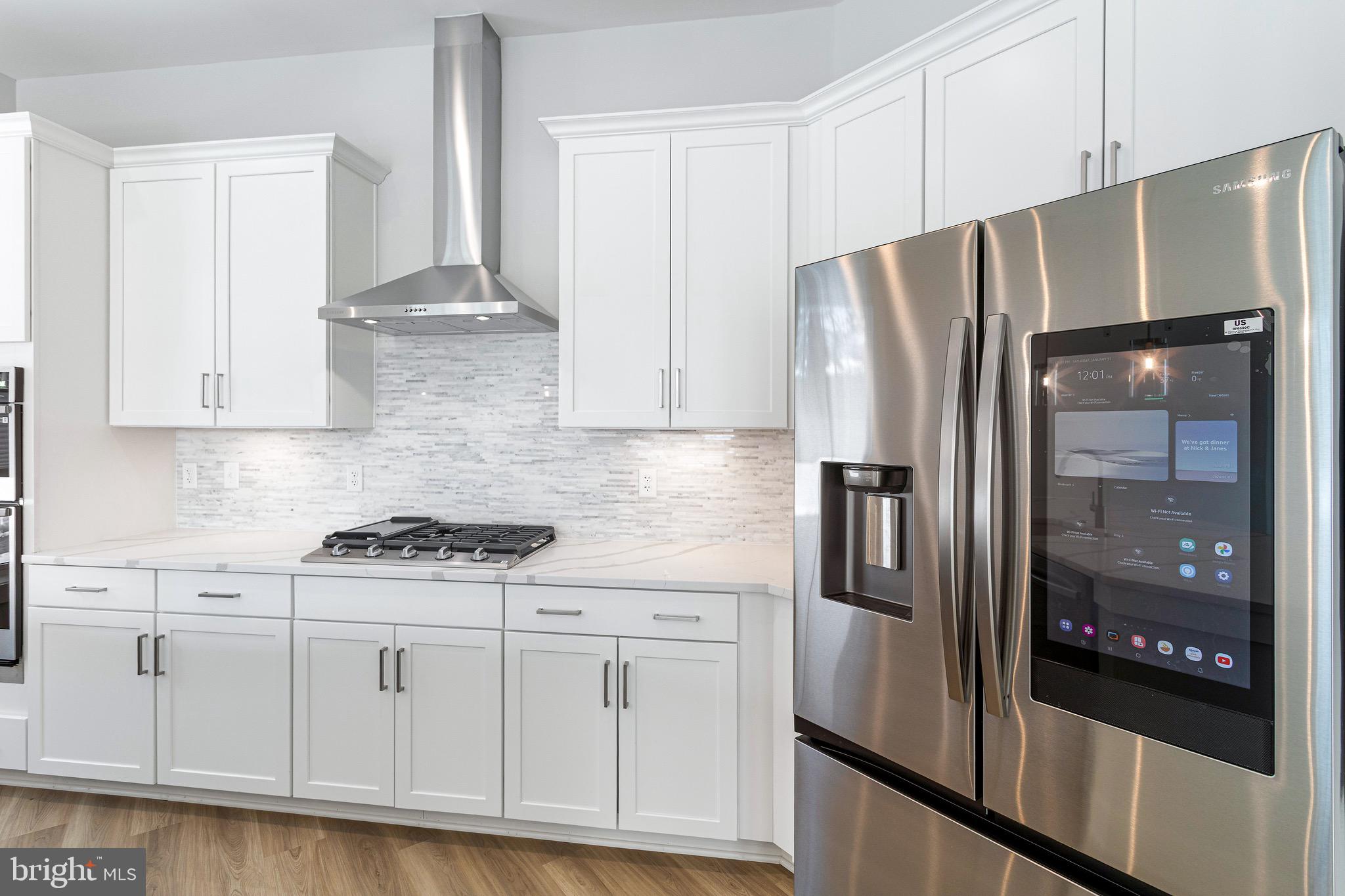 76 Old Mill Bottom Road North, Unit 102 Annapolis, MD 21409 - Photo 24 of 42 a kitchen with stainless steel appliances granite countertop a refrigerator and a stove
