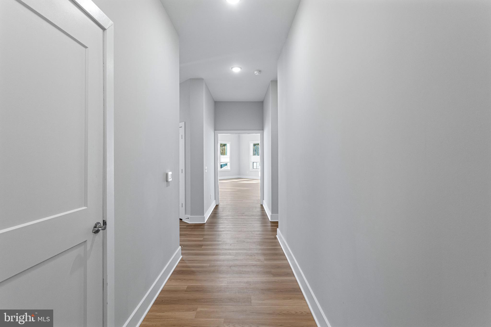 76 Old Mill Bottom Road North, Unit 102 Annapolis, MD 21409 - Photo 25 of 42 a view of a hallway with the wooden floor