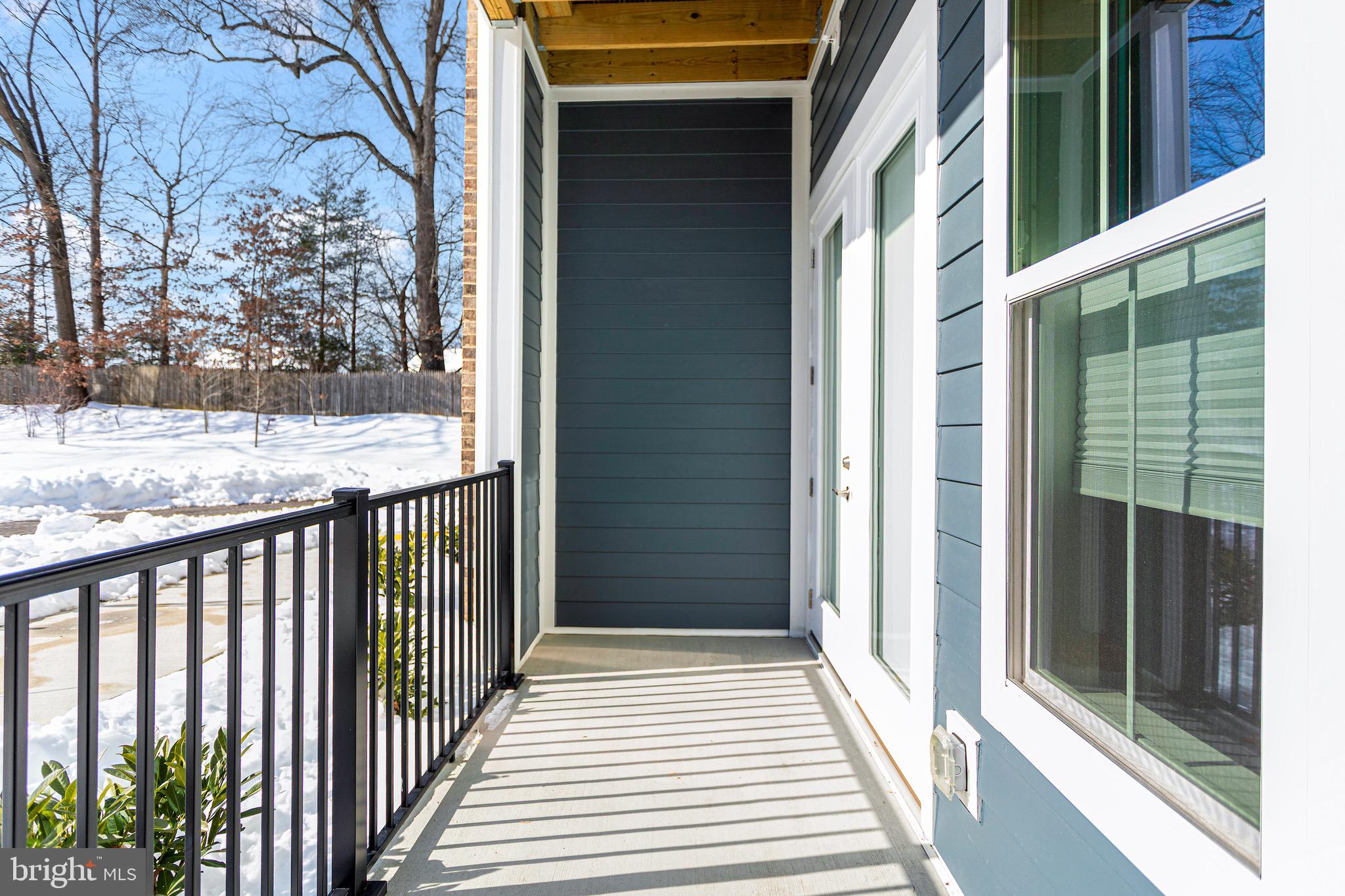 76 Old Mill Bottom Road North, Unit 102 Annapolis, MD 21409 - Photo 35 of 42 a view of a balcony with wooden floor