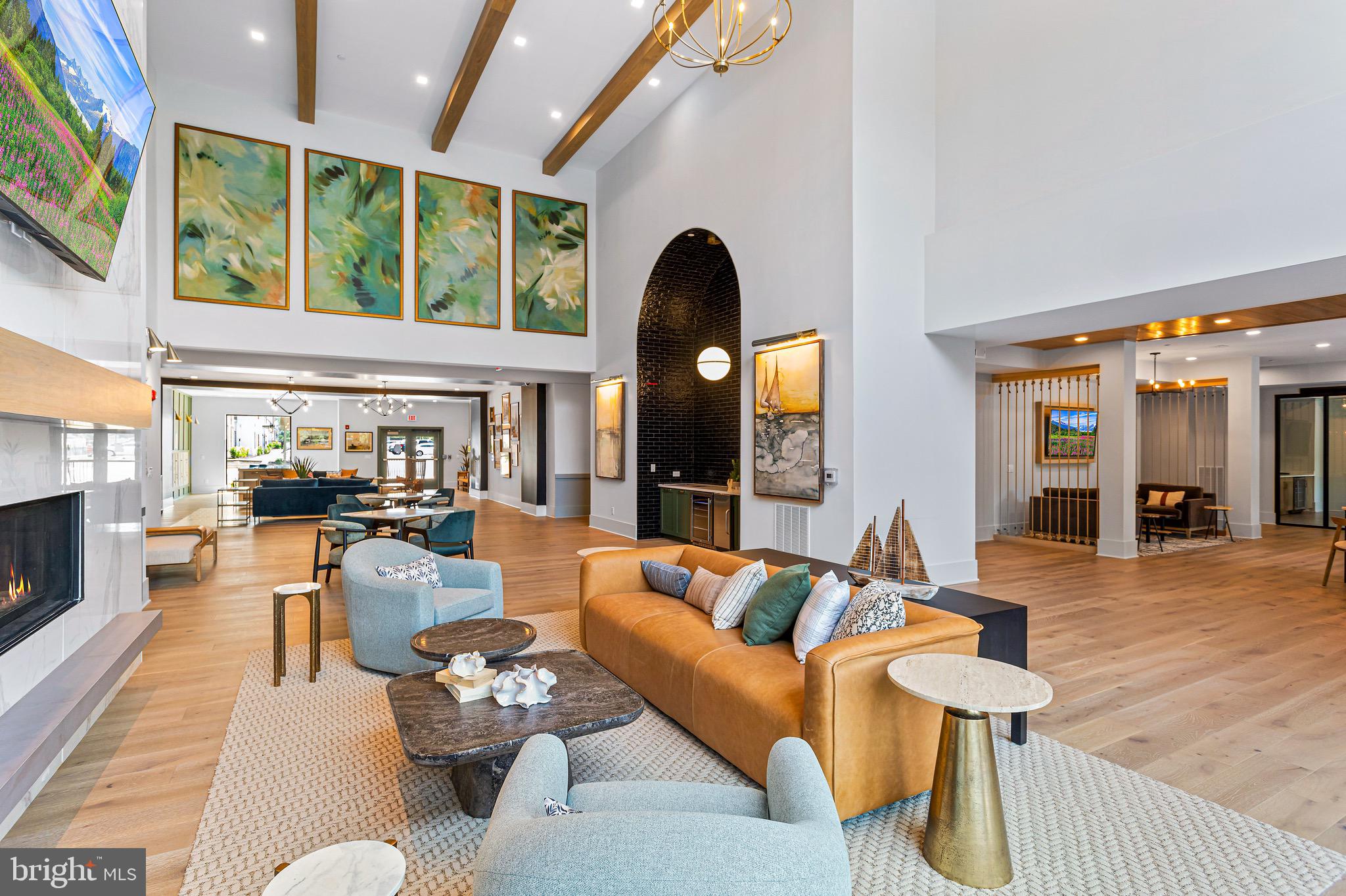 76 Old Mill Bottom Road North, Unit 102 Annapolis, MD 21409 - Photo 10 of 42 a living room with furniture and a large window