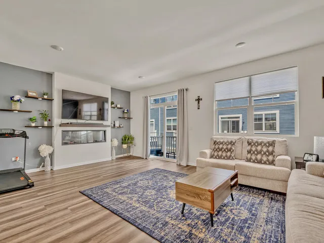 a living room with furniture and a rug