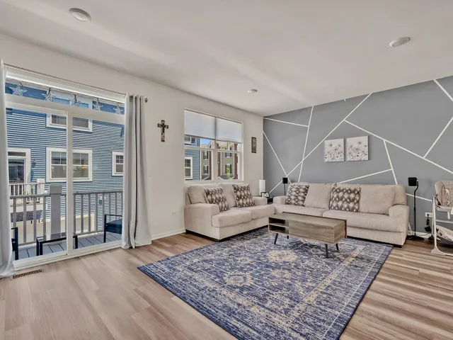 a living room with furniture and a rug