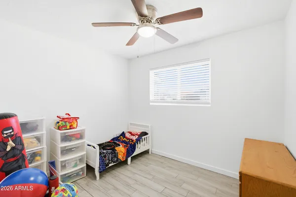 a room with toys and wooden floor