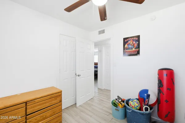 a hallway with toys and wooden floor