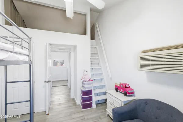 a view of room with toys and stairs