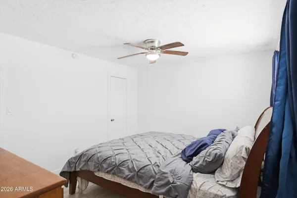 a view of a bedroom with a bed