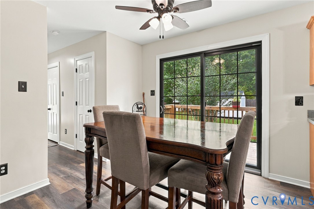 133 Ford Road Bumpass, VA 23024 - Photo 17 of 55 Dining area with dark wood table and upholstered c