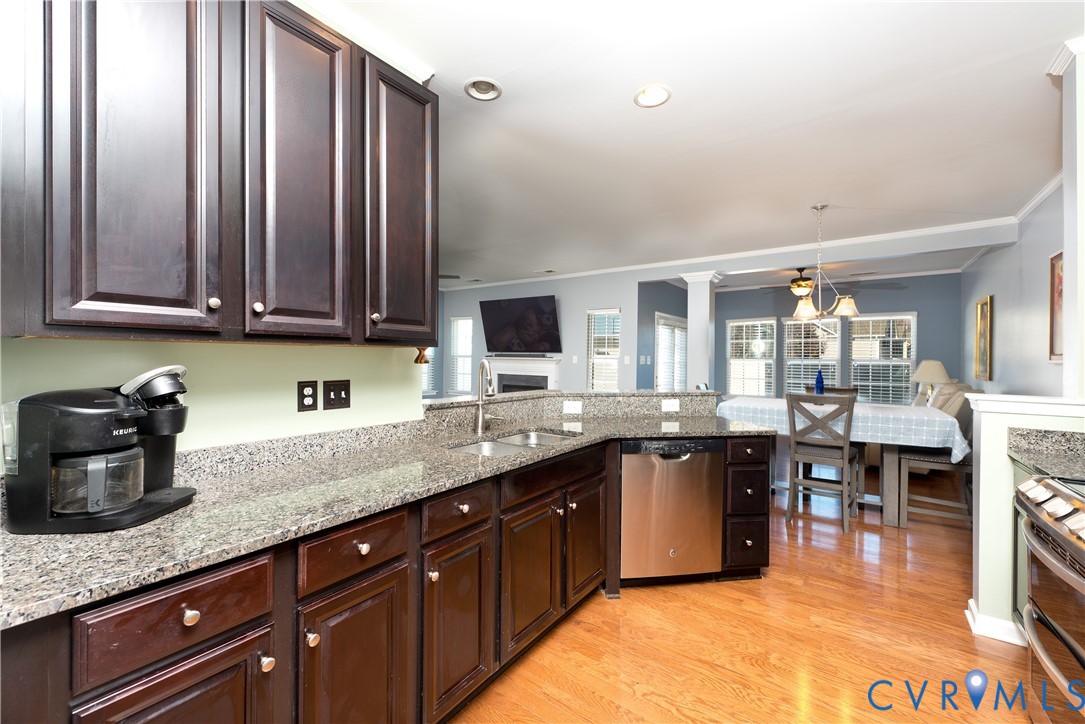 10343 Colony Bee Place Mechanicsville, VA 23116 - Photo 13 of 50 a kitchen with stainless steel appliances granite countertop a sink counter space and cabinets
