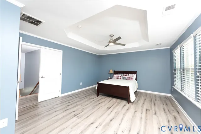 a bedroom with a bed and a lamp