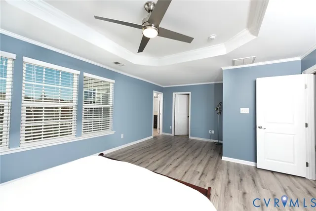 a bathroom with a sink a toilet and shower curtain