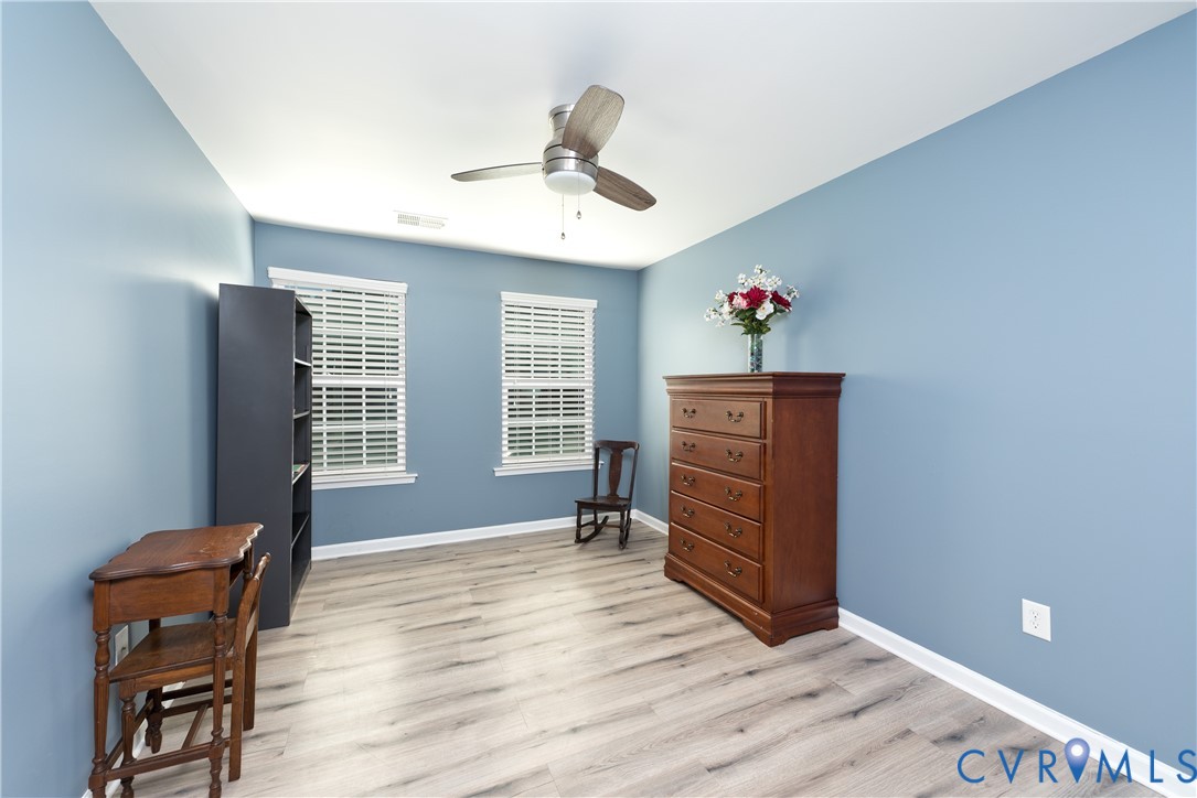 10343 Colony Bee Place Mechanicsville, VA 23116 - Photo 28 of 50 a living room with furniture and wooden floor
