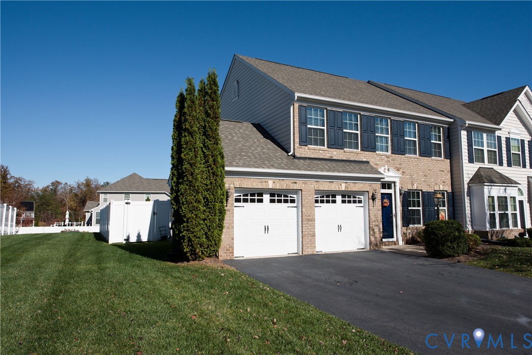10343 Colony Bee Place Mechanicsville, VA 23116 - Photo 48 of 50 a front view of a house with a yard