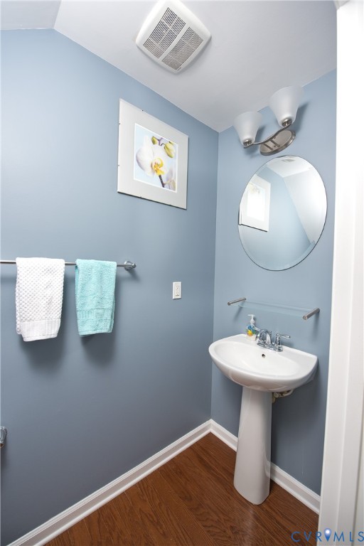 10343 Colony Bee Place Mechanicsville, VA 23116 - Photo 6 of 50 a bathroom with a sink and a mirror