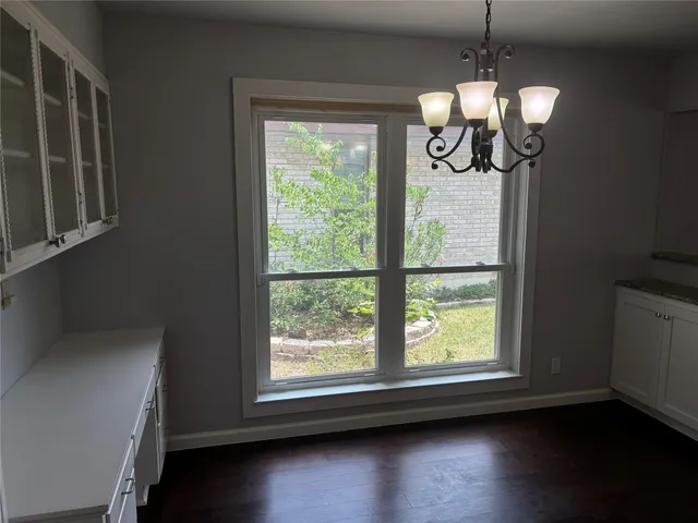 a view of dining room and wooden floor