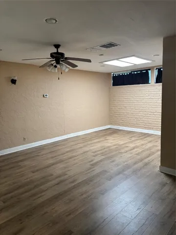 a view of a big room with wooden floor