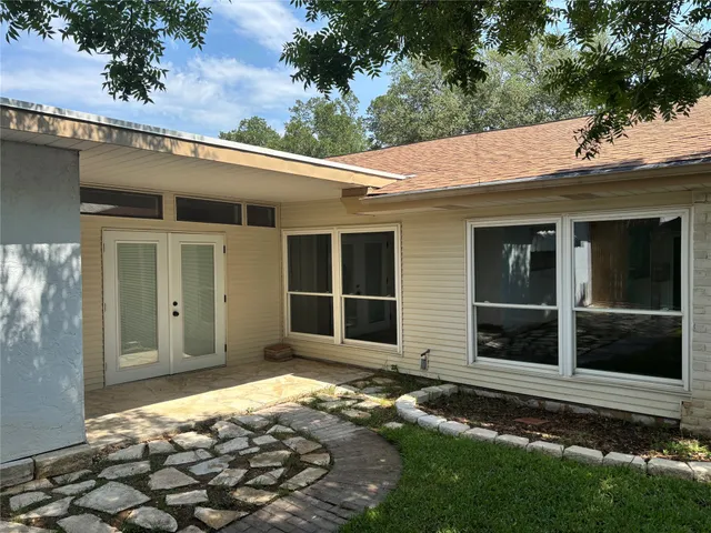 a house with trees in the background