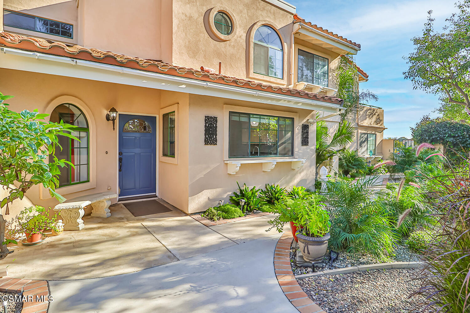 2911 Fanshell Walk Oxnard, CA 93035 - Photo 1 of 42 a front view of a house with plants