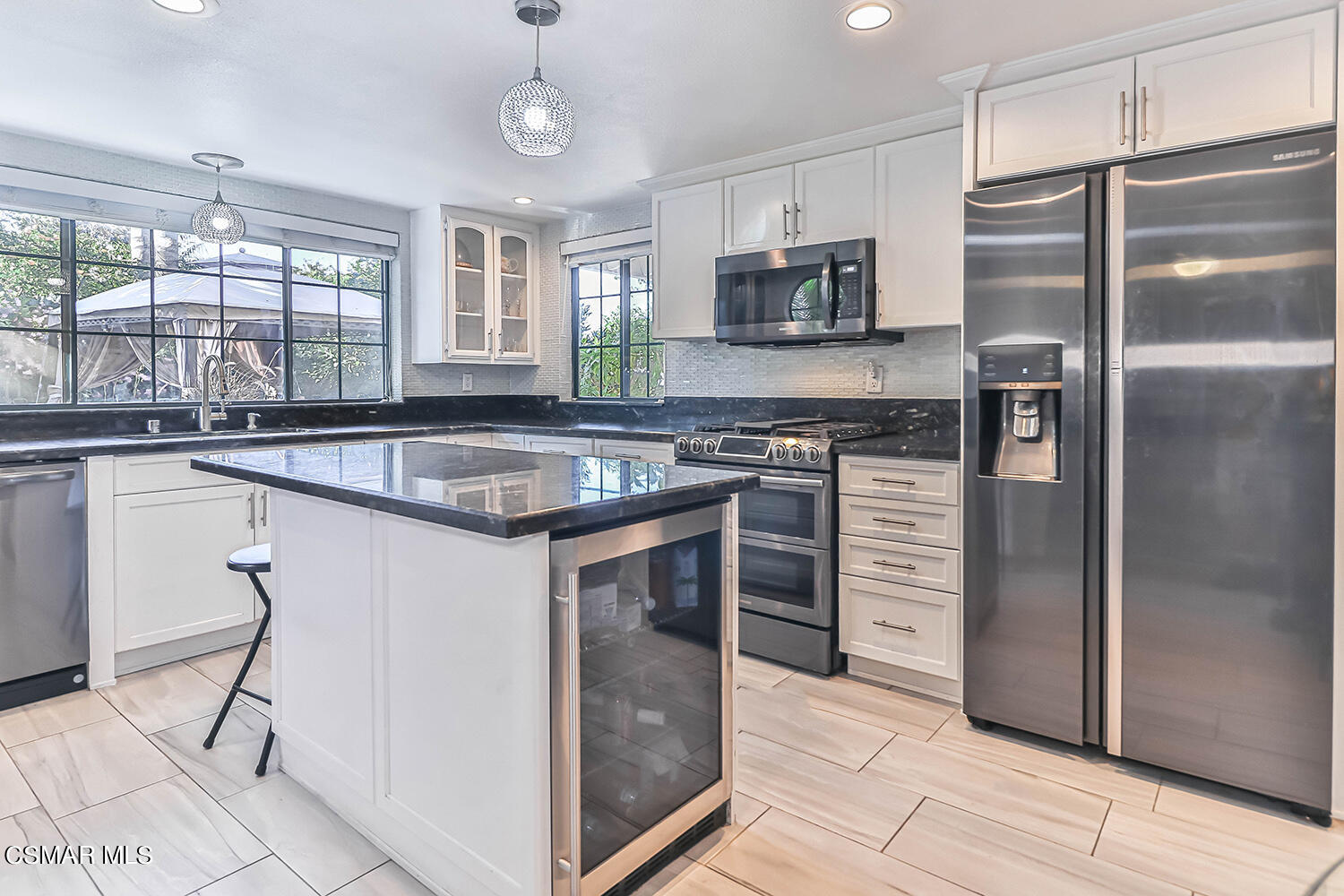 2911 Fanshell Walk Oxnard, CA 93035 - Photo 11 of 42 a kitchen with stainless steel appliances granite countertop a sink and a refrigerator
