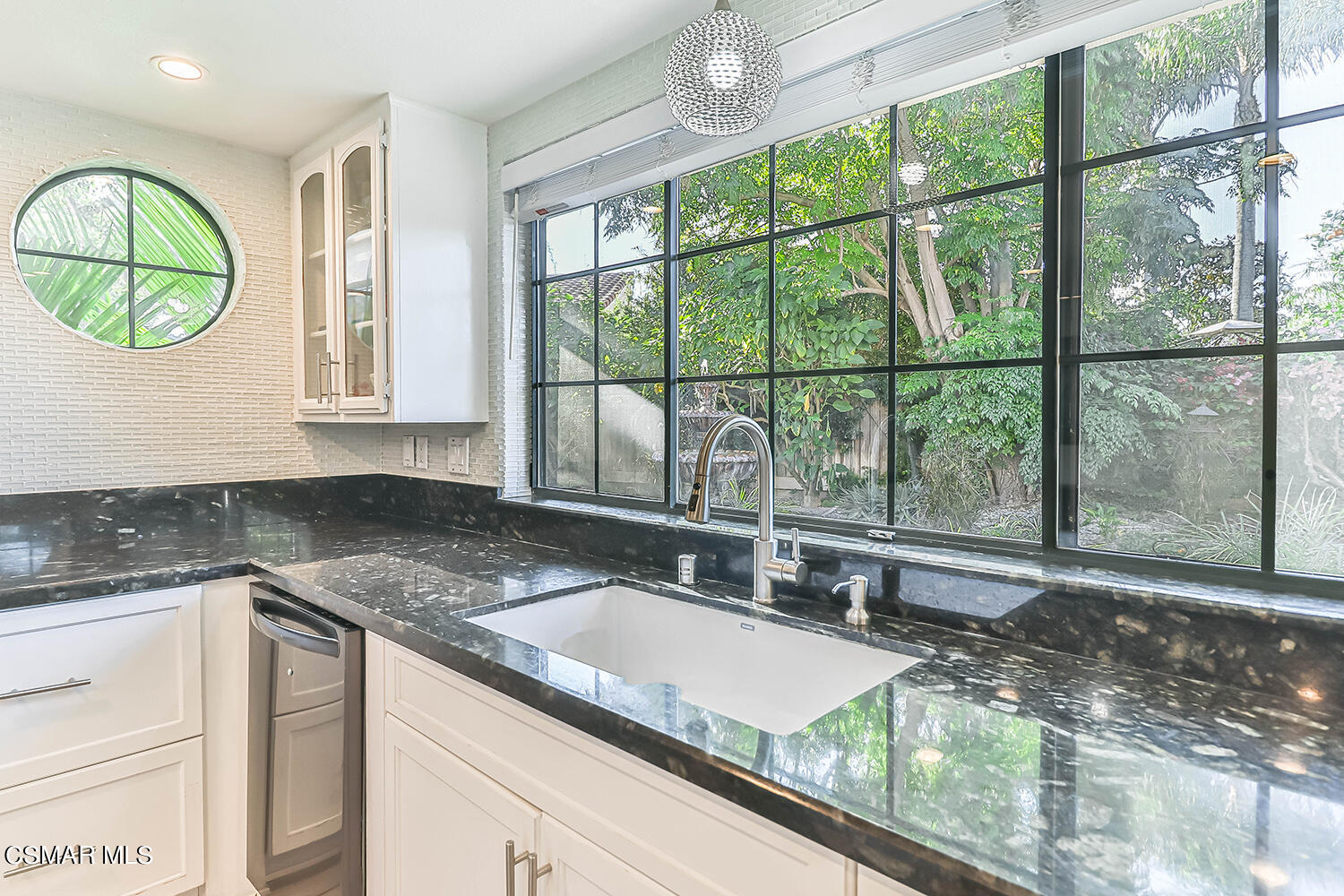 2911 Fanshell Walk Oxnard, CA 93035 - Photo 13 of 42 a kitchen with a sink and a large window