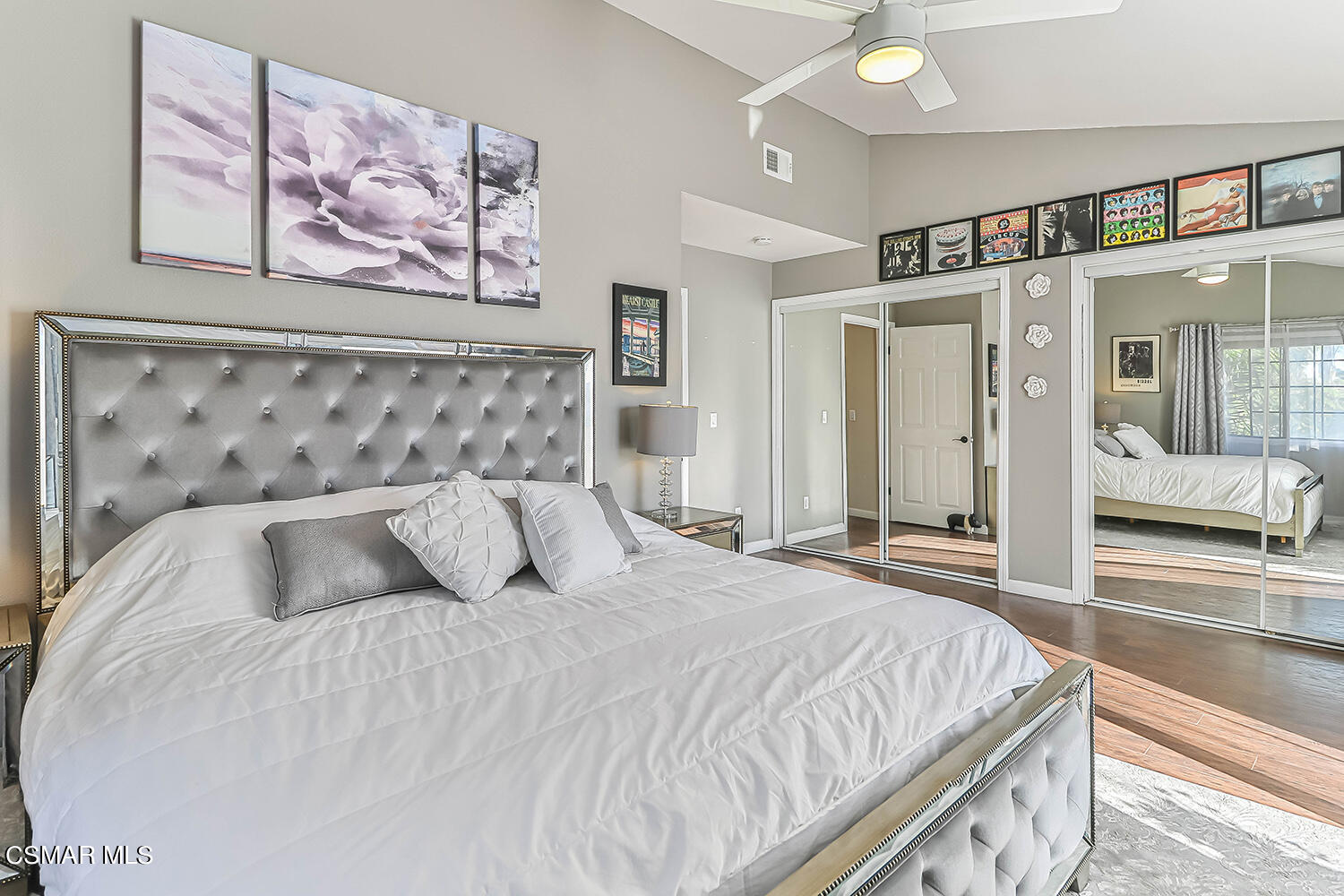 2911 Fanshell Walk Oxnard, CA 93035 - Photo 30 of 42 a bedroom with a large bed and a chandelier