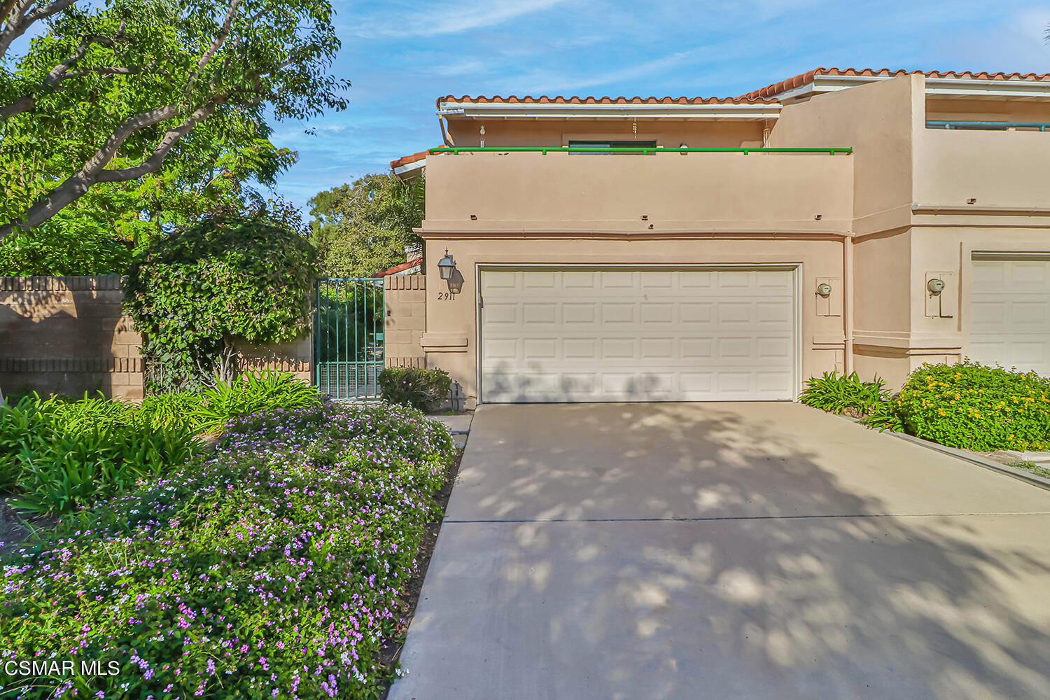 2911 Fanshell Walk Oxnard, CA 93035 - Photo 38 of 42 a front view of a house with a yard and garage