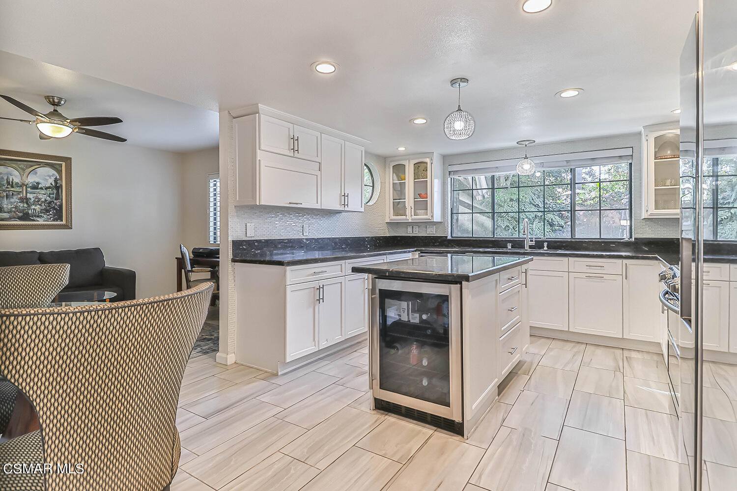 2911 Fanshell Walk Oxnard, CA 93035 - Photo 10 of 42 a kitchen with a sink stove and cabinets
