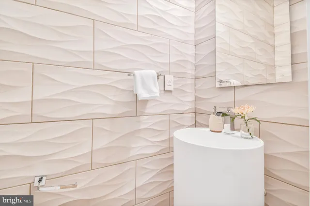 a living room with furniture and stairs