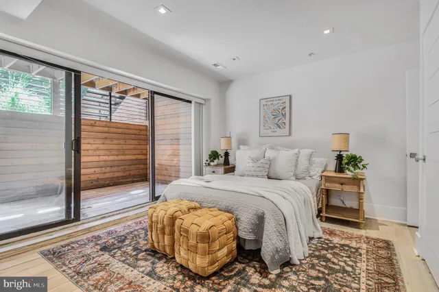 a bedroom with bed and a window