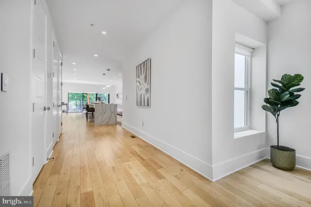 a view of a living room and hardwood floor