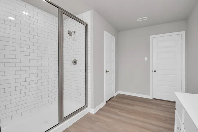 a bathroom with a double vanity sink and a mirror