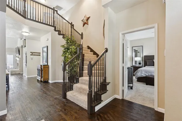 a view of entryway and hall with wooden floor