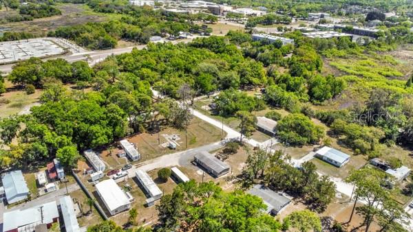8333 Emmons Avenue New Port Richey, FL 34653 - Photo 6 of 14 an aerial view of residential house with outdoor space and trees all around