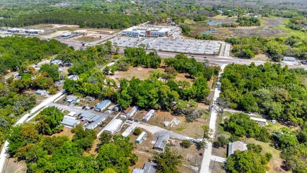 8333 Emmons Avenue New Port Richey, FL 34653 - Photo 7 of 14 an aerial view of a house with a yard and lake view