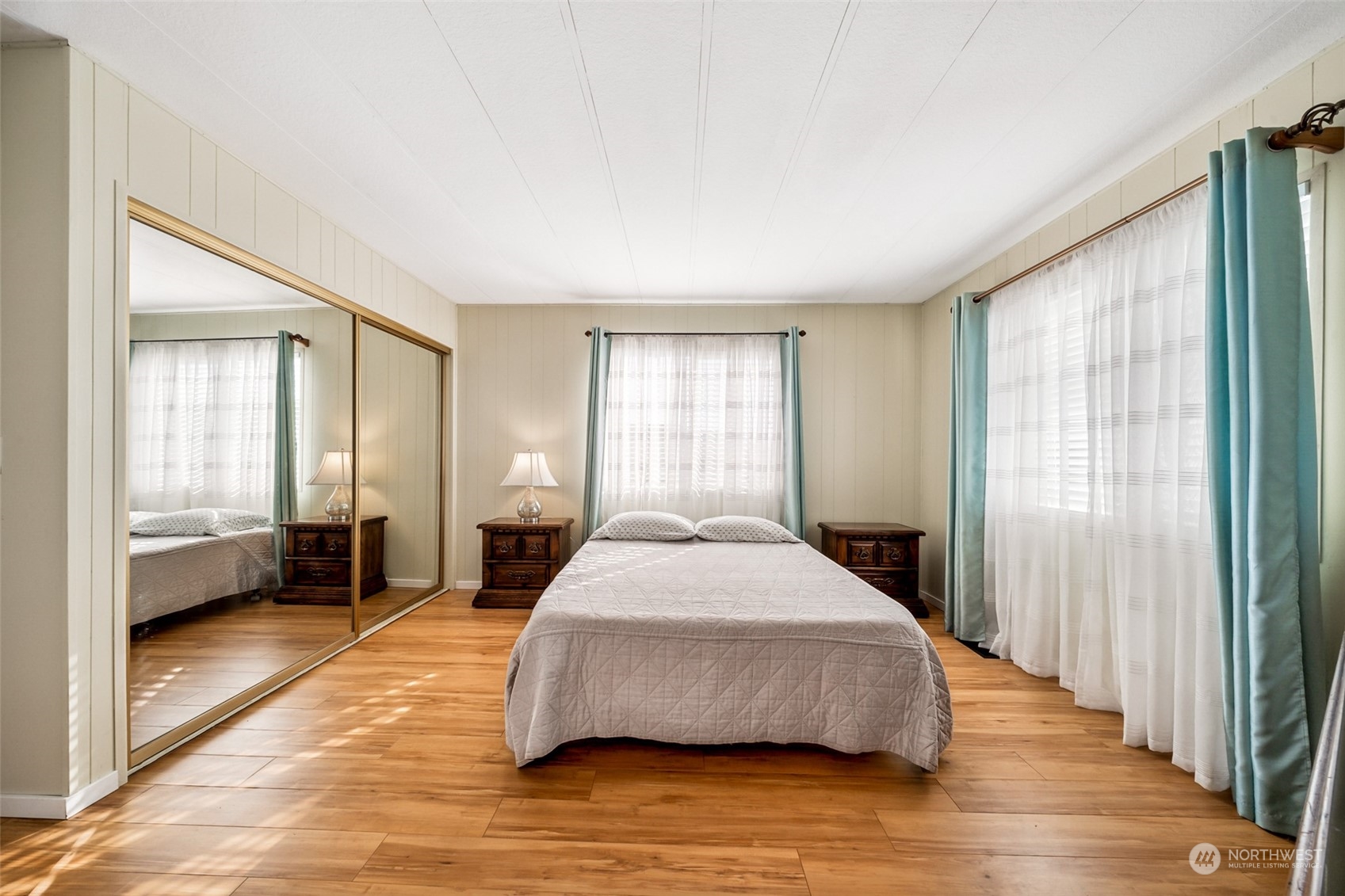 1272 Spruce Drive Enumclaw, WA 98022 - Photo 12 of 23 a spacious bedroom with a large bed and a large window