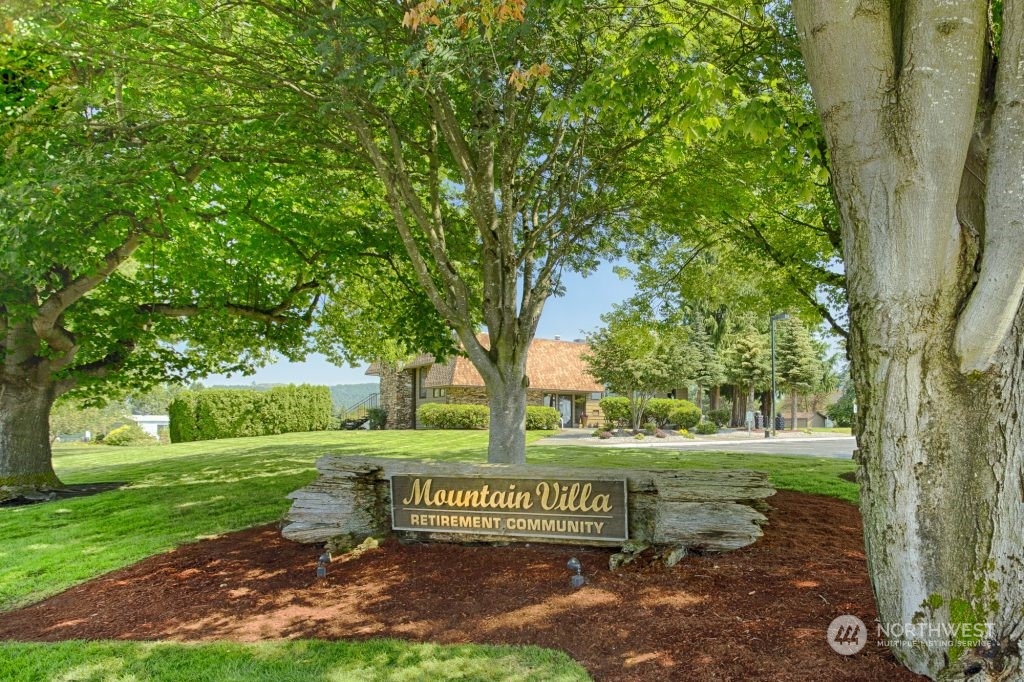 1272 Spruce Drive Enumclaw, WA 98022 - Photo 21 of 23 a view of a park that has a bench and a bench with large trees