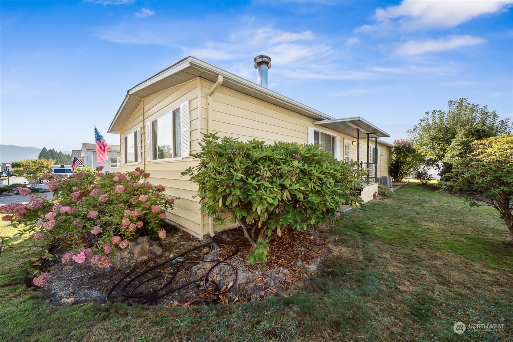 1272 Spruce Drive Enumclaw, WA 98022 - Photo 3 of 23 a front view of a house with a yard