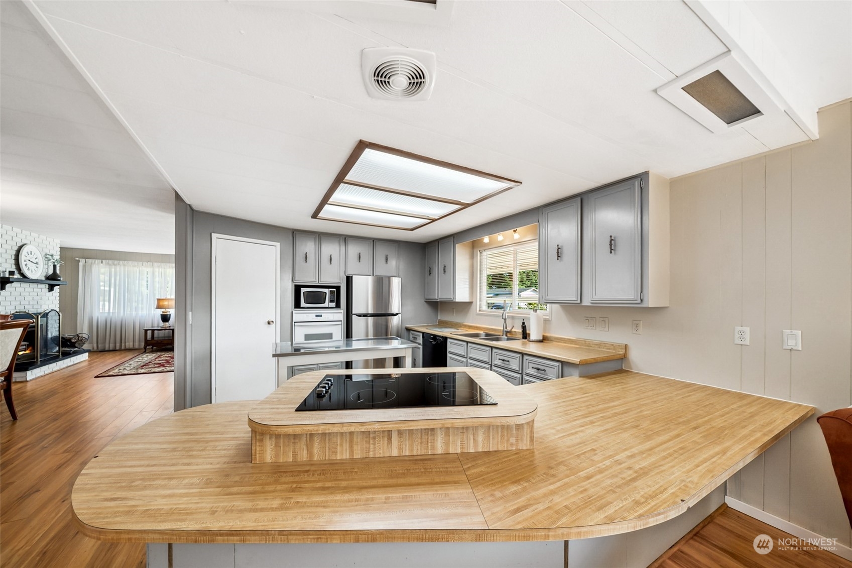 1272 Spruce Drive Enumclaw, WA 98022 - Photo 6 of 23 a kitchen with sink refrigerator and window