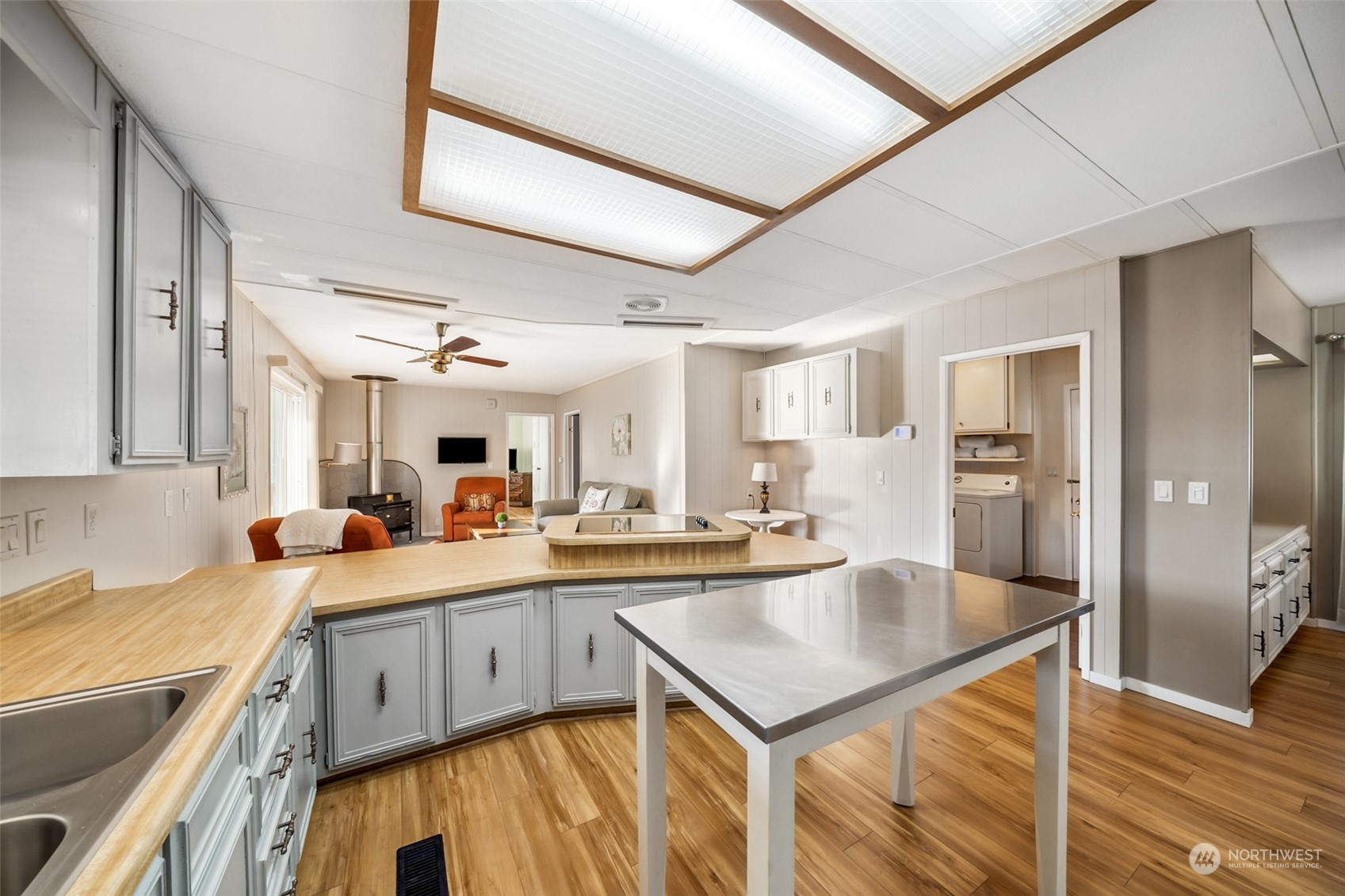1272 Spruce Drive Enumclaw, WA 98022 - Photo 7 of 23 a kitchen with a sink a stove and cabinets