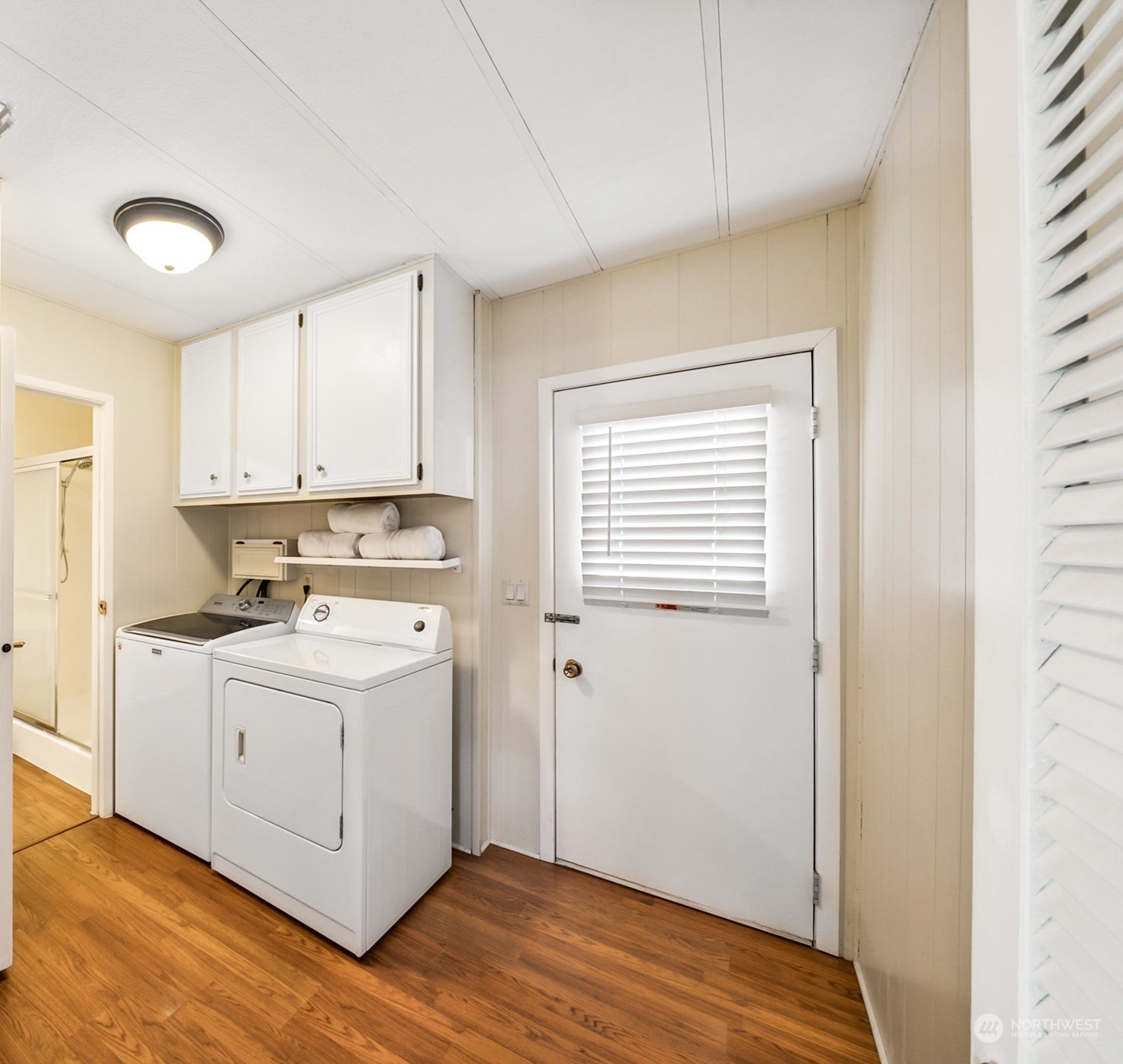 1272 Spruce Drive Enumclaw, WA 98022 - Photo 10 of 23 a view of a kitchen with a sink wooden floor and a window