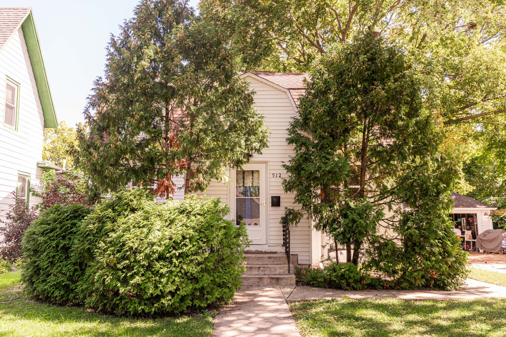 512 North 6th Street, Unit 1 DeKalb, IL 60115 - Photo 1 of 15 a front view of a house with a yard and garage
