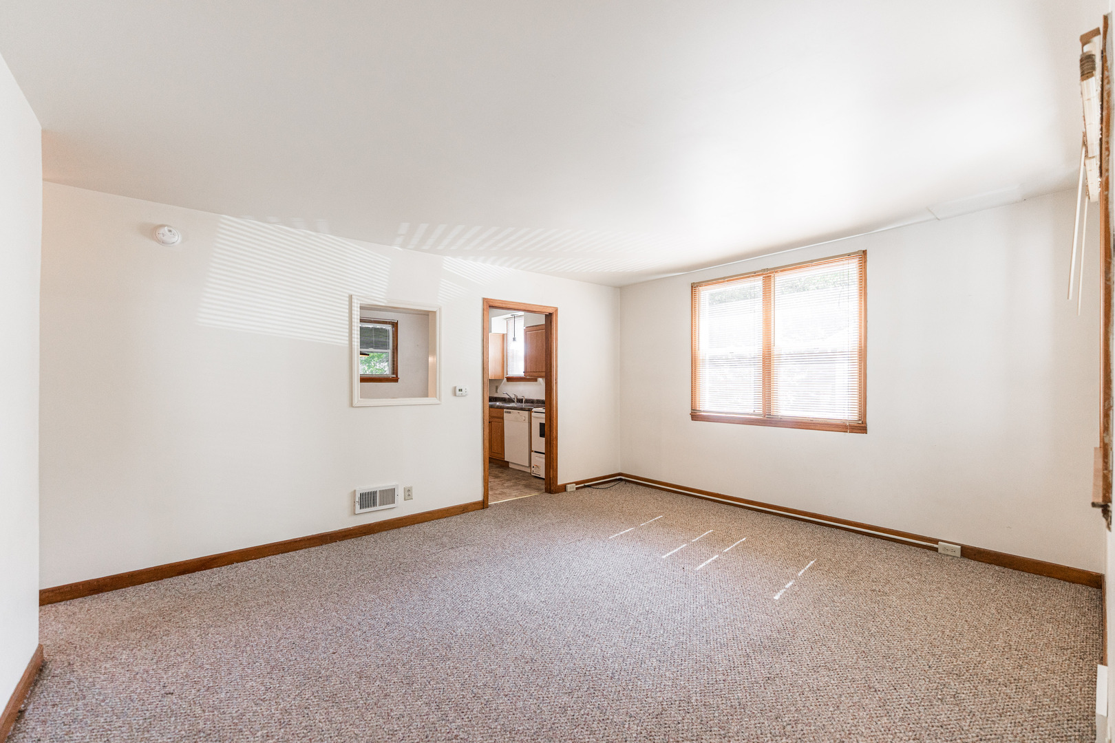512 North 6th Street, Unit 1 DeKalb, IL 60115 - Photo 2 of 15 an empty room with windows
